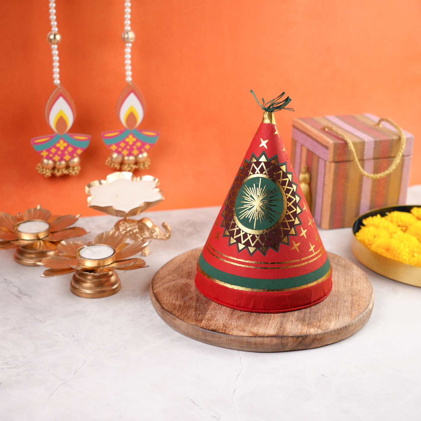 Diwali Ka Anaar Gift Box cracker-shaped keepsake styled with Diwali décor, reusable festive packaging for gifting.
