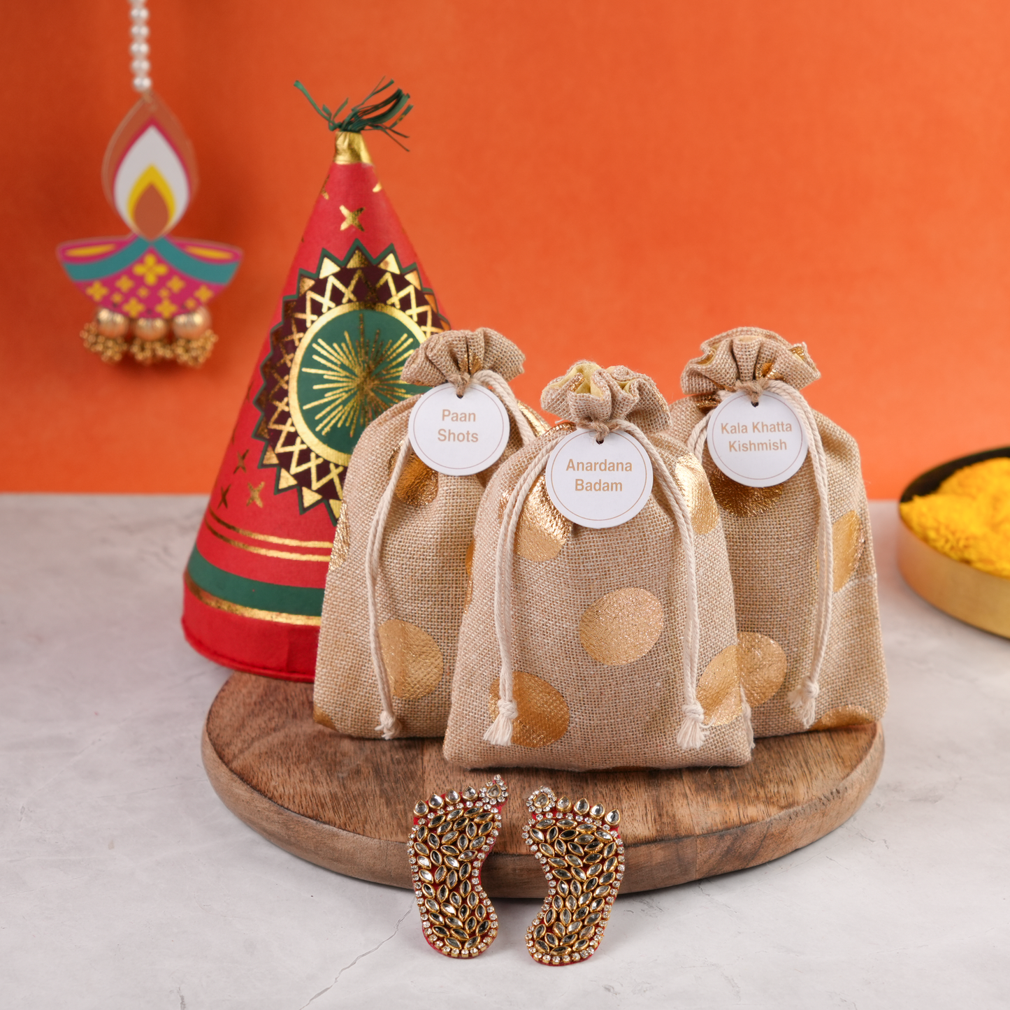 Open Diwali Ka Anaar Gift Box in cracker shape with festive potlis and reusable keepsake design.