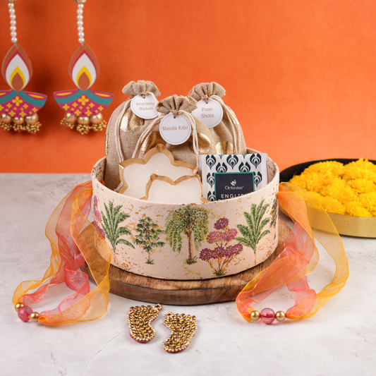 Vanmahal Diwali Hamper open keepsake box in heritage floral print with potlis, candles, and premium tea pack for festive gifting.